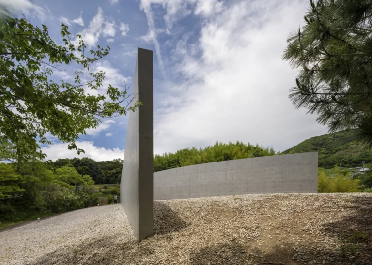 Water Temple in Awaji, Japan designed by Tadao Ando, with a circular lotus pond concealing an underground sanctuary, emphasizing minimalism and spatial sequence.