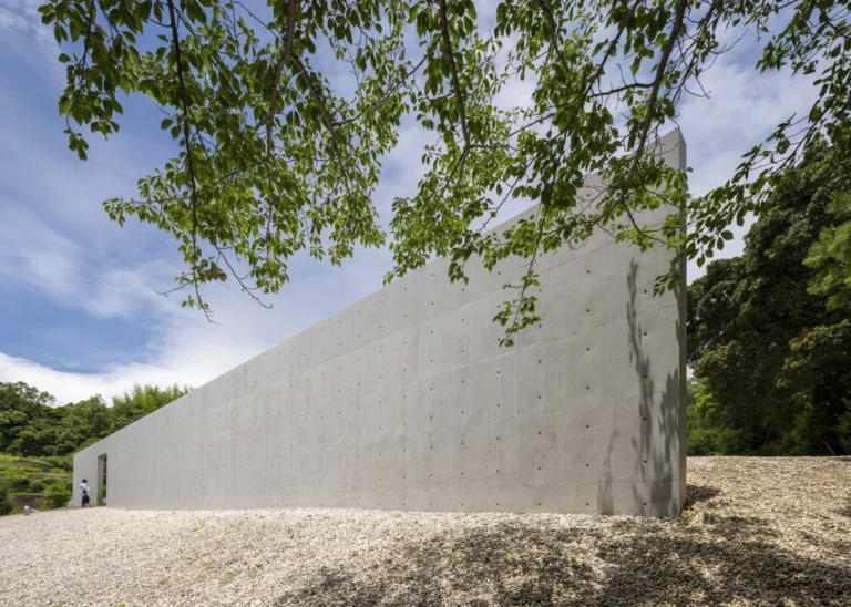 Water Temple in Awaji, Japan designed by Tadao Ando, with a circular lotus pond concealing an underground sanctuary, emphasizing minimalism and spatial sequence.