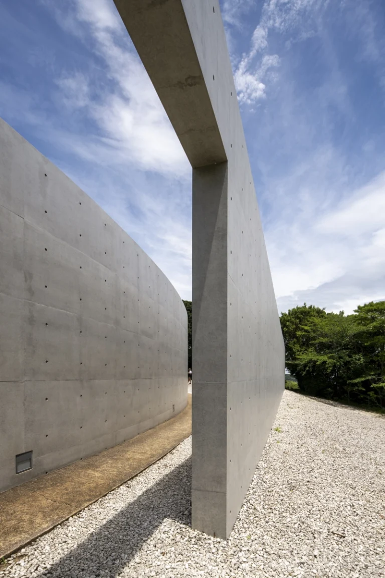Water Temple in Awaji, Japan designed by Tadao Ando, with a circular lotus pond concealing an underground sanctuary, emphasizing minimalism and spatial sequence.