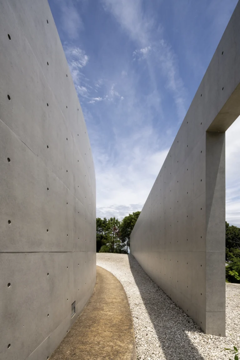 Water Temple in Awaji, Japan designed by Tadao Ando, with a circular lotus pond concealing an underground sanctuary, emphasizing minimalism and spatial sequence.