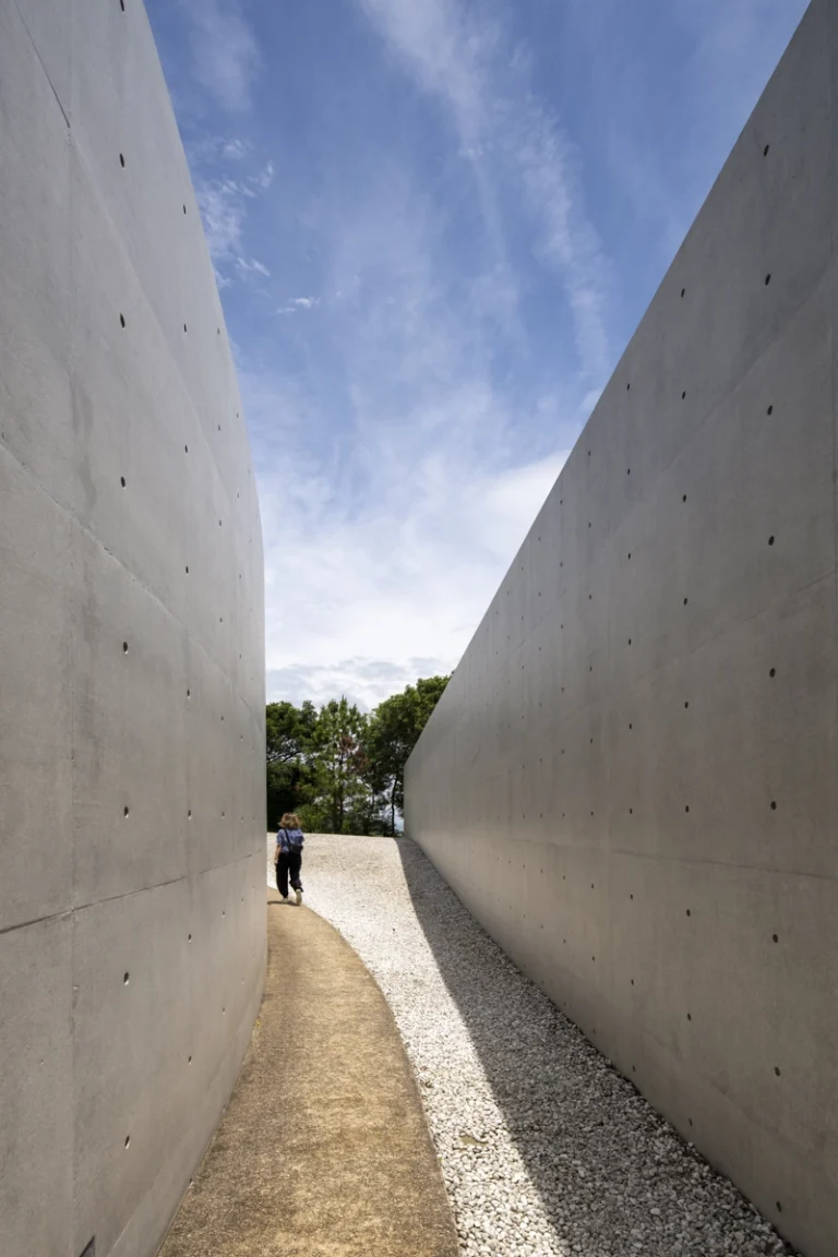 Water Temple in Awaji, Japan designed by Tadao Ando, with a circular lotus pond concealing an underground sanctuary, emphasizing minimalism and spatial sequence.