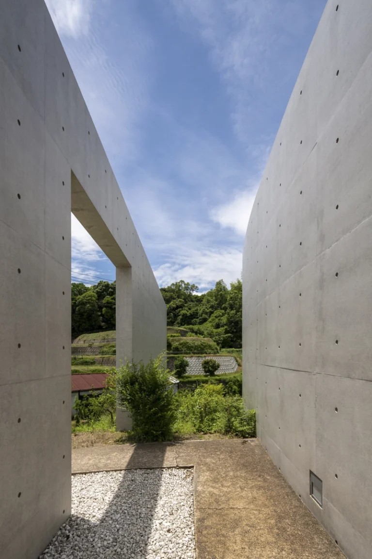 Water Temple in Awaji, Japan designed by Tadao Ando, with a circular lotus pond concealing an underground sanctuary, emphasizing minimalism and spatial sequence.
