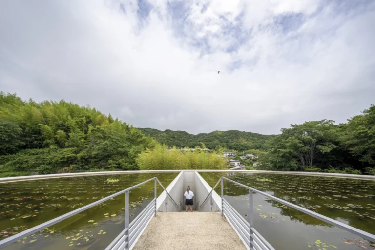 Water Temple in Awaji, Japan designed by Tadao Ando, with a circular lotus pond concealing an underground sanctuary, emphasizing minimalism and spatial sequence.