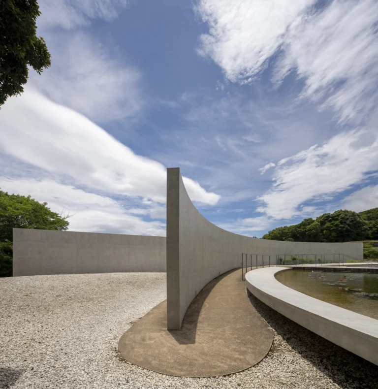 Water Temple in Awaji, Japan designed by Tadao Ando, with a circular lotus pond concealing an underground sanctuary, emphasizing minimalism and spatial sequence.