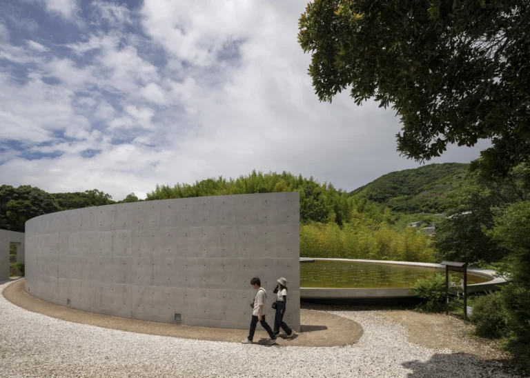 Water Temple in Awaji, Japan designed by Tadao Ando, with a circular lotus pond concealing an underground sanctuary, emphasizing minimalism and spatial sequence.